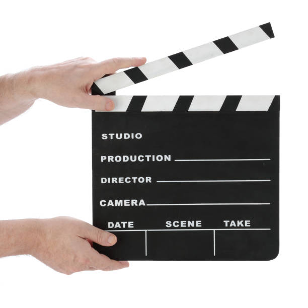 istock Hands holding a classic hollywood chalk clapperboard open on a white background 1181716683