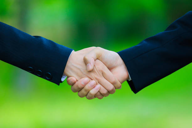 istock A person shaking hands in nature 1181718292