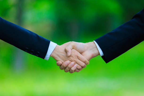 istock A person shaking hands in nature 1181718296
