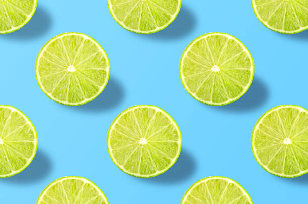 istock Vivid fruit pattern of fresh lime on colourful background 1181718362