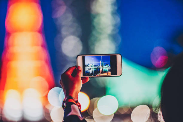 istock A person shooting a night scene with a smartphone 1181720016