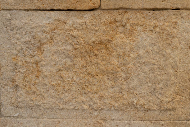 istock Old building block of weathered sandstone 1181720498