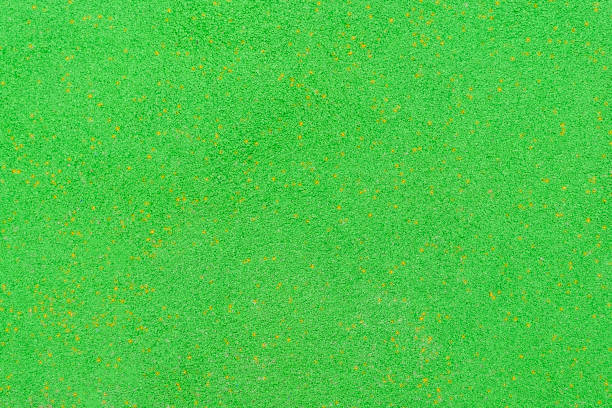 Bright green rubber crumb coating. Soft background made of anti-traumatic material