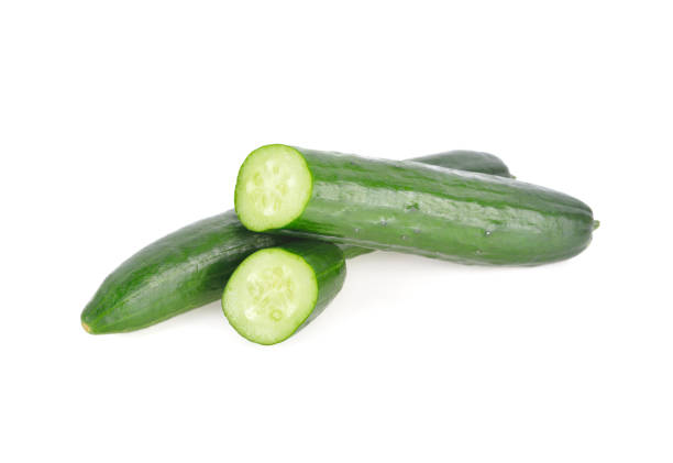 istock whole and sliced fresh Japanese cucumbers on white background 1181722911