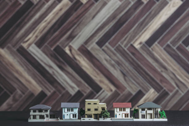 istock Modern tree background and miniature house 1181724529