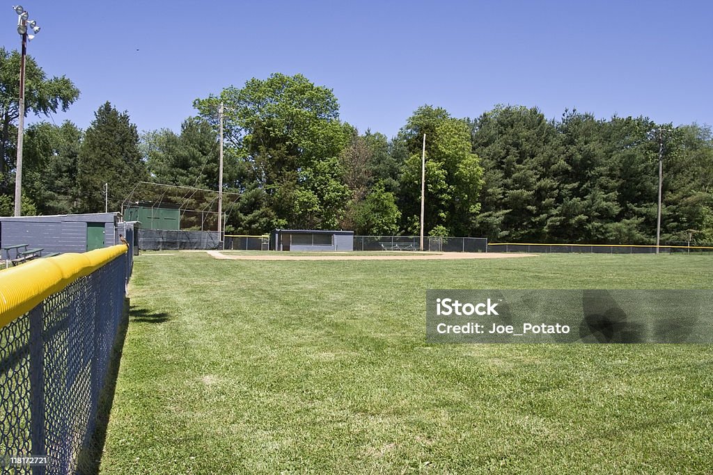 View from Right Field Baseball field. Youth League. Blue sky. Horizontal.-For more fences, click here.  FENCES  Baseball - Sport Stock Photo