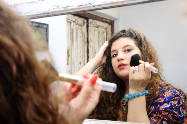 istock young woman with curls 1181727500