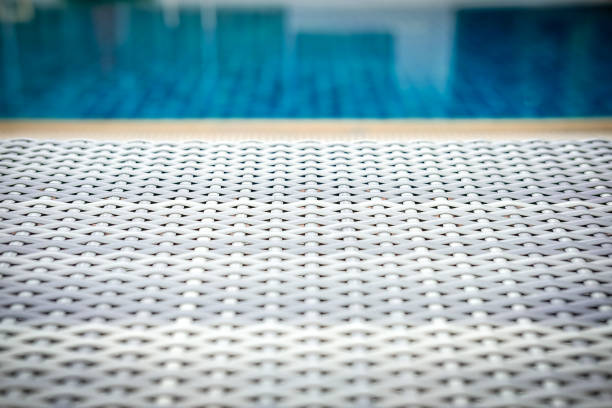 istock wicker rattan pool sun bed deckchair at swimming pool 1181729422