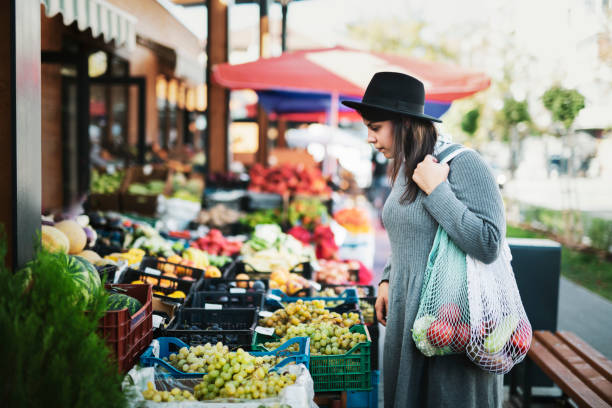 istock Woman Buying Fruit And Vegetables 1181729779