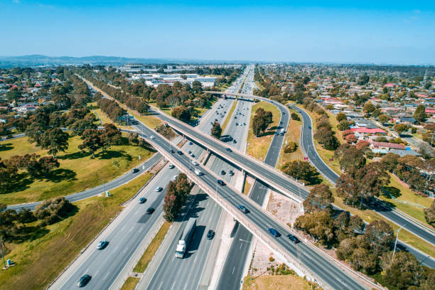 istock Straight highway passing through interchange in Melbourne, Australia - aerial view 1181732355