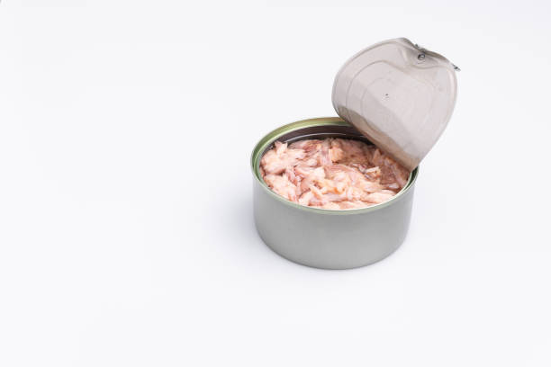 istock Open canned tuna tin on a white background; copy space, soft light, studio shot 1181732395