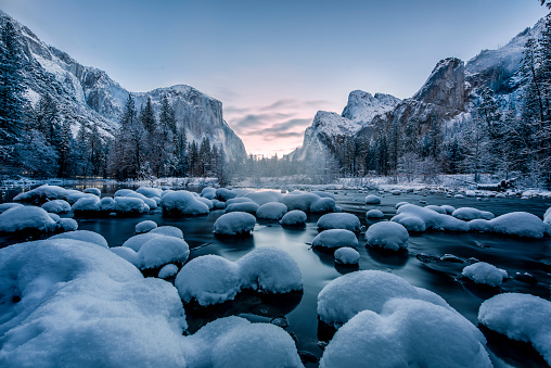 Right after a major snow storm, all stones and plants are covered with untuched snow. This photo was taken before sunrise.