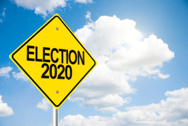 Road sign Election 2020 on sky