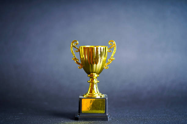 istock Winner cup and gray background 1181748354