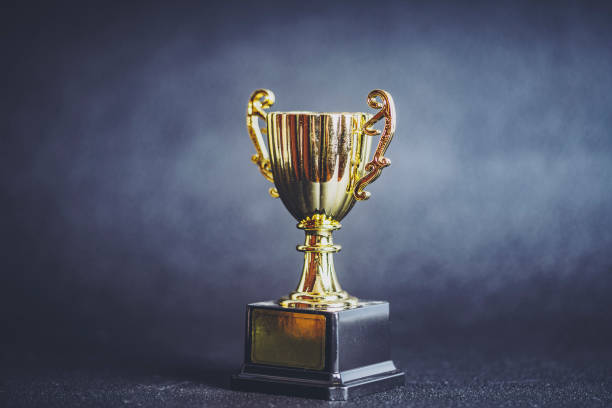 istock Winner cup and gray background 1181748386