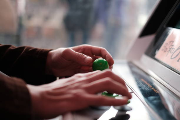 istock The hands of a person playing computer games 1181748598