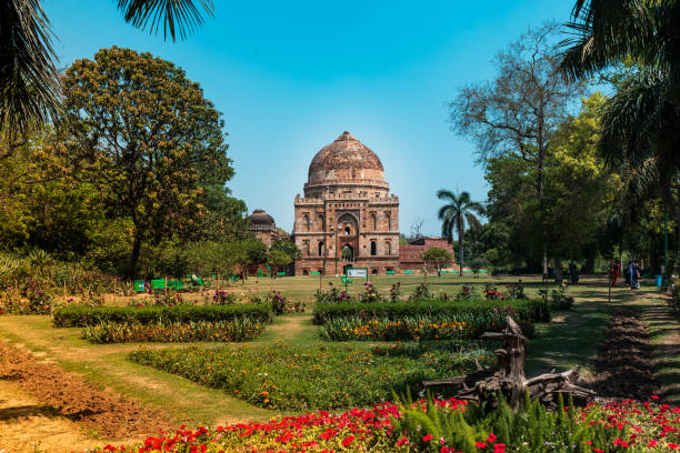 A Popular garden in Delhi, India. The famous tomb at the Lodhi garden also known 'Bara Gumbad' with beautiful garden area on sunny morning in Delhi, India. lodi gardens stock pictures, royalty-free photos & images