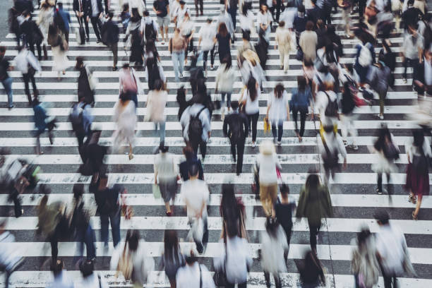 istock People crossing a pedestrian crossing 1181752892