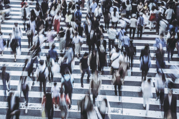 istock People crossing a pedestrian crossing 1181752900