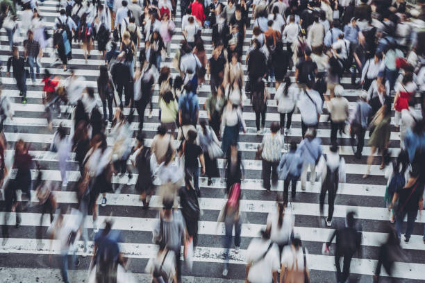 istock People crossing a pedestrian crossing 1181752906