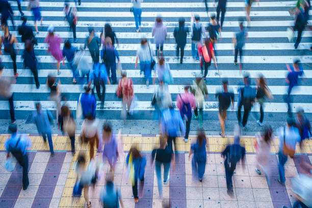istock People crossing a pedestrian crossing 1181752924