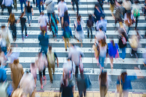 istock People crossing a pedestrian crossing 1181752931