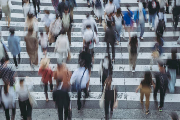 istock People crossing a pedestrian crossing 1181752940