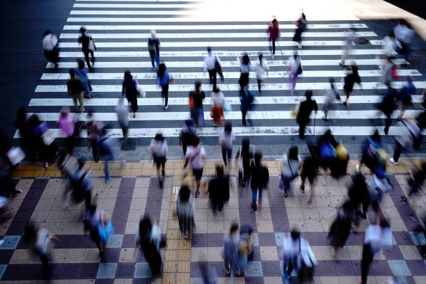 istock People crossing a pedestrian crossing 1181752941
