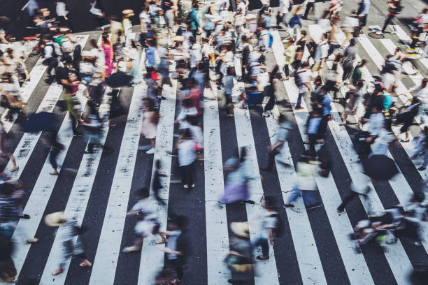 istock People crossing a pedestrian crossing 1181752943