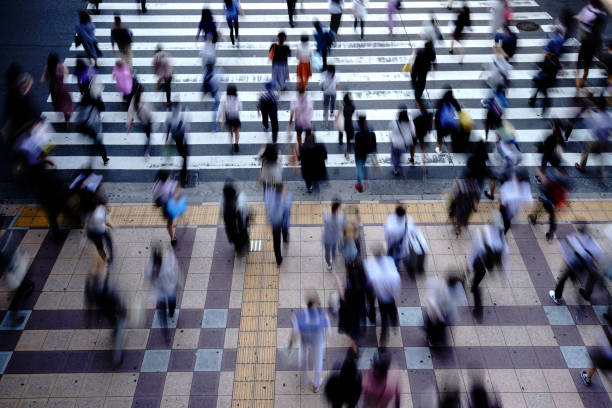 istock People crossing a pedestrian crossing 1181752944
