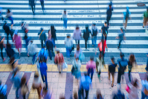istock People crossing a pedestrian crossing 1181752956