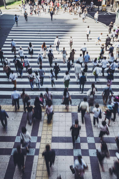 istock People crossing a pedestrian crossing 1181752959