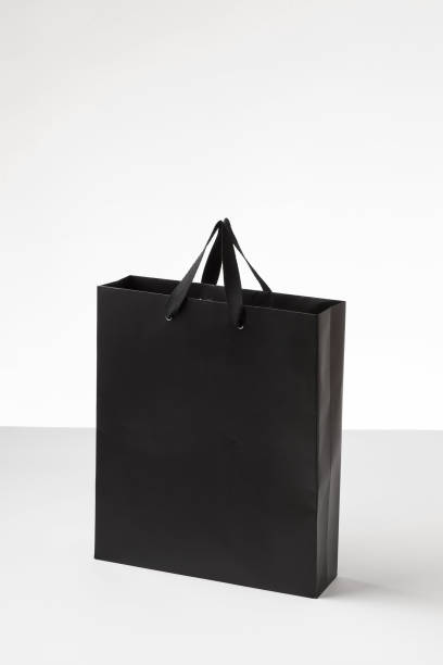 istock Black shopping paper bag in a white background. 1181753966