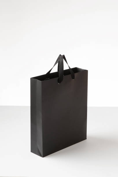 istock Black shopping paper bag in a white background. 1181753967