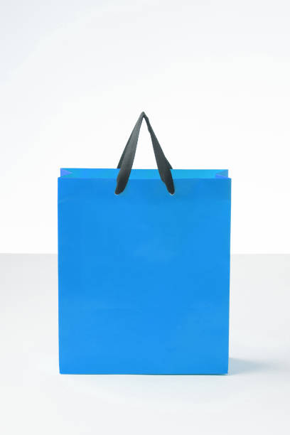 istock Blue shopping paper bag in a white background. 1181753977