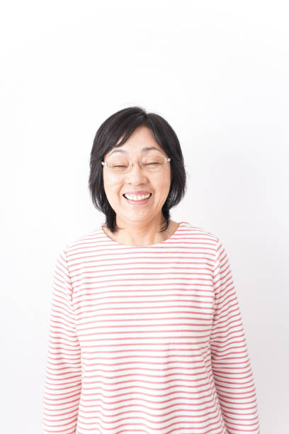 istock Senior woman smiling on white background 1181761065