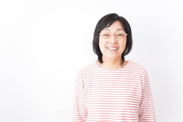 istock Senior woman smiling on white background 1181761069
