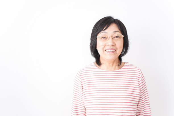 istock Senior woman smiling on white background 1181761072