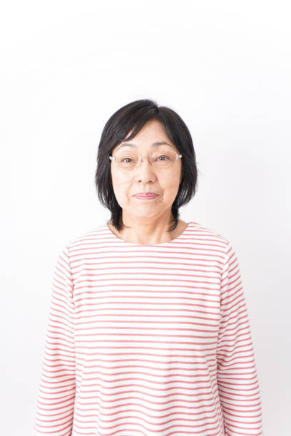 istock Senior woman smiling on white background 1181761076