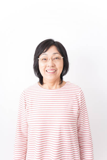 istock Senior woman smiling on white background 1181761092