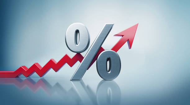 Percentage Sign with Red Arrow Moving Up on Defocused Background Percentage sign standing on reflective surface with red arrow moving up on defocused  background. Horizontal composition with copy space. interest rate photos stock pictures, royalty-free photos & images