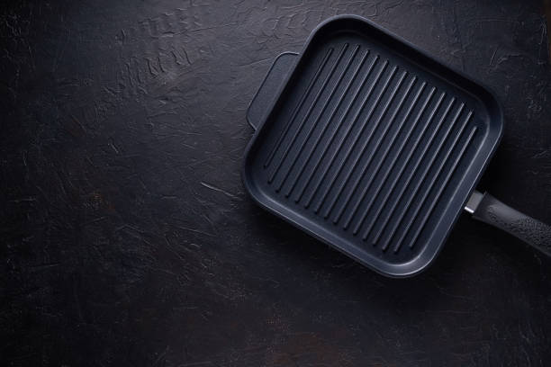 istock Black Grill pan on dark stone background Copy space Top view 1181765422