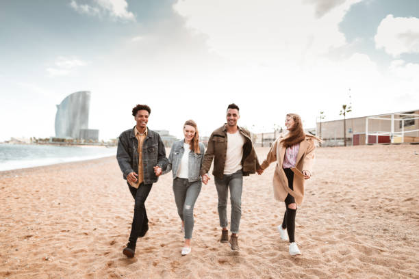istock friends walking together in Barceloneta 1181767720