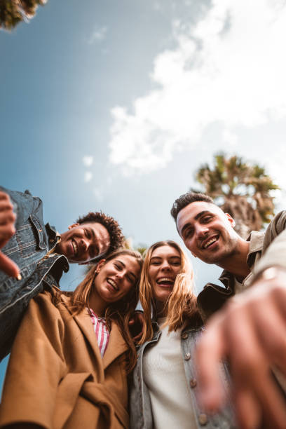 friends embracing in Barceloneta friends embracing in Barceloneta adolescents hanging out stock pictures, royalty-free photos & images