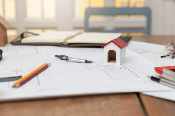 istock Engineer and Architect concept, Engineer Architects and Real estate agent office team working with blueprints 1181771157