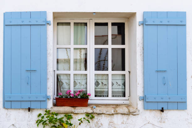 istock Old window with wooden blue painted shutters 1181771177