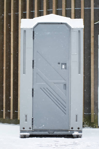 istock Grey colour chemical WC covered by snow 1181772281