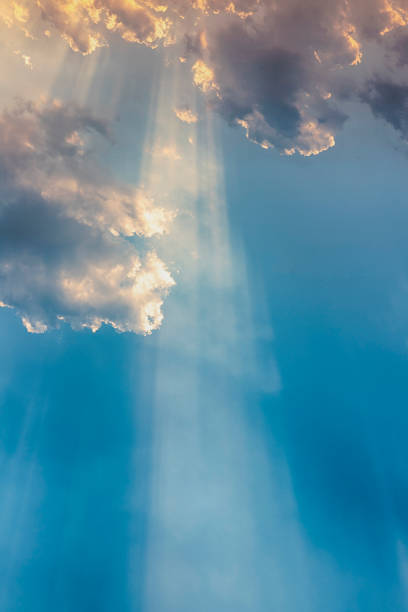 istock Besutiful ray of sunlight breaking through clouds at sunset. 1181772527