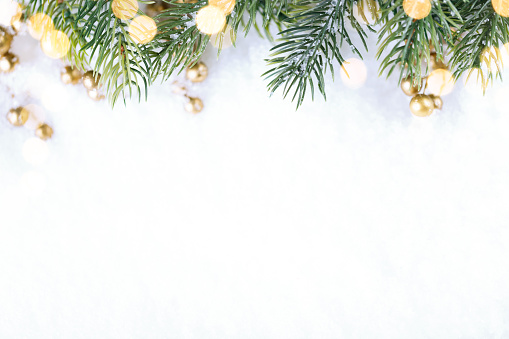Closeup of Christmas tree with light, snow flake. Christmas and New Year holiday background. vintage color tone.