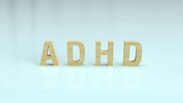 istock The ADHD wood text on glossy plate for medical content 3d rendering. 1181777773